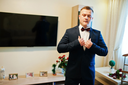 Young stylish strong man on his wedding day. Morning groomの写真素材