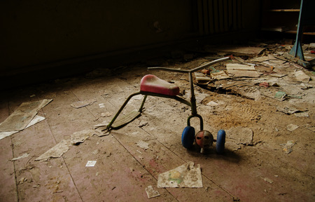 Soviet toys of rusty baby bike in Chernobyl nuclear disaster area.の写真素材