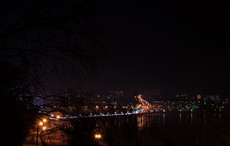Panorama of night city lights and reflections on lake at Ternopil, Ukraine, Europe.の写真素材