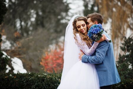 Someone special lovely wedding couple in love at winter day.の写真素材