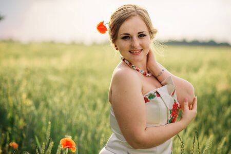 Young girl at ukrainian national dress posed at wreath field.の写真素材