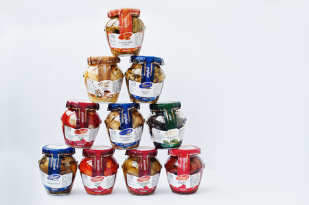 Athens, Greece - February 22, 2017: Pyramid of different italian pickled in jar La Cerignola di una volta.のeditorial素材