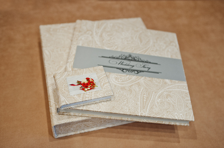 Elegant wedding album and photo book from beige material.の写真素材