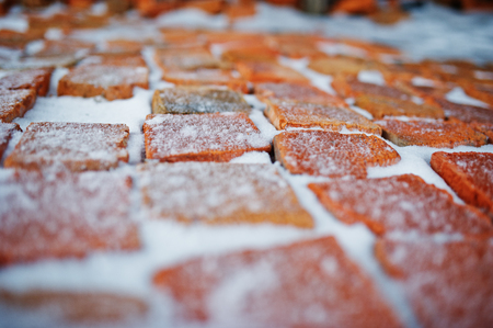 Old bricks at plant outdoor covered with snow.の写真素材