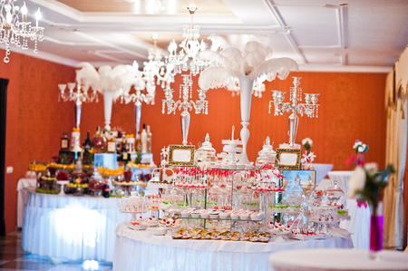 Royal elegance wedding reception table with different cookery food.の写真素材