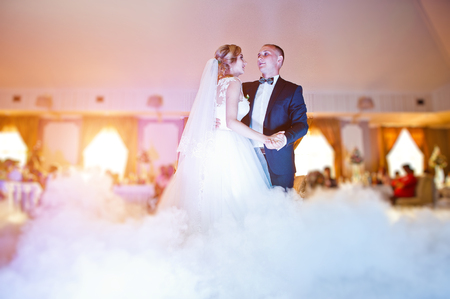 Amazing first wedding dance with fog smoke at dancefloor and various lights.の写真素材