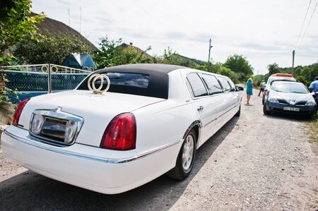 Chortkiv, Ukraine -16 July 2016: Elegant luxury white wedding limousine outdoor.のeditorial素材
