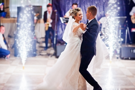 First wedding dance with fireworks of gorgeous wedding couple.の写真素材
