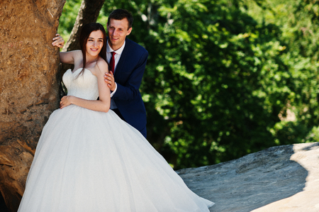 Lovely wedding couple at amazing landscapes with rock Dovbush, Carpathian mountains at Ukraine.の写真素材