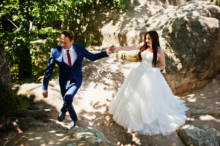 Lovely wedding couple at amazing landscapes with rock Dovbush, Carpathian mountains at Ukraine.の写真素材