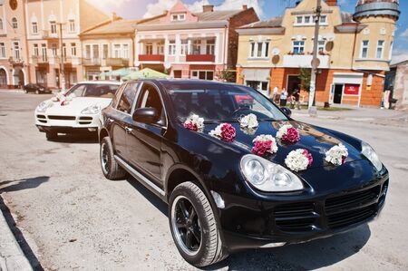 Elegant wedding cars with decor on the hood.の写真素材