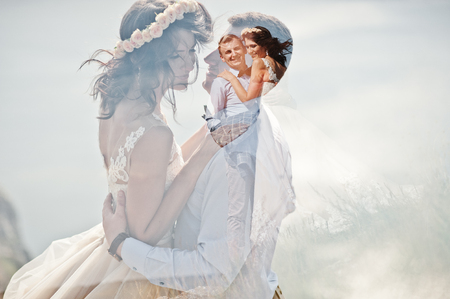 Lomographic photo of the wedding couple hugging.の写真素材