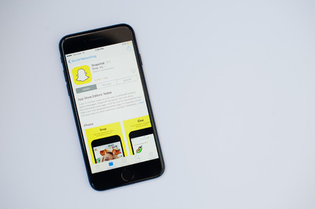 Kyiv, Ukraine - Jul 11,2017: Apple iPhone 7 with Snapchat application on the screen at App Store...