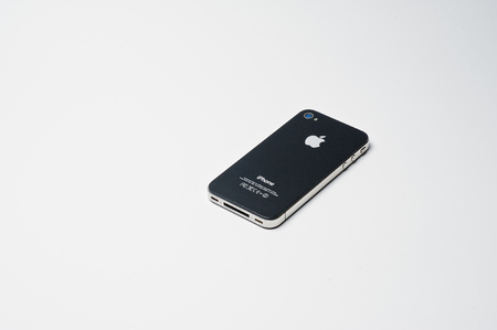 Hai, Ukraine - August 10, 2017: close-up photo of an iPhone 4 smartphone made by Apple on the white...