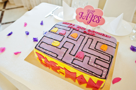 Hai, Ukraine - August 10, 2017: delicious and colorful Pac-Man cake on the table.のeditorial素材