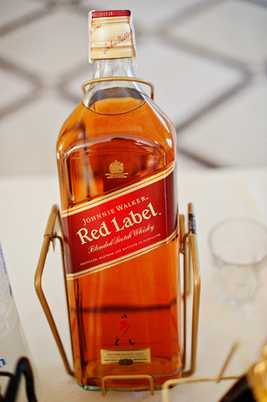 Hai, Ukraine - August 10, 2017: close-up photo of Red Label whiskey on the table in restaurant or bar.のeditorial素材