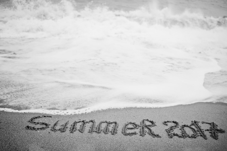 Summer 2017 end. New Year 2018 is coming concept. Sea and sand.の写真素材