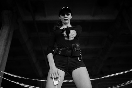 Sexy female agent at abandoned place.
