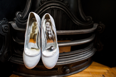 Close-up photo of bridal gorgeous white wedding high heels.の写真素材