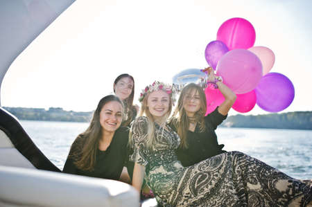 Girls having fun at yacht on hen party.の写真素材