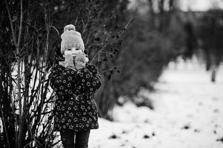 Cute little girl having fun outdoors on winter day.の写真素材