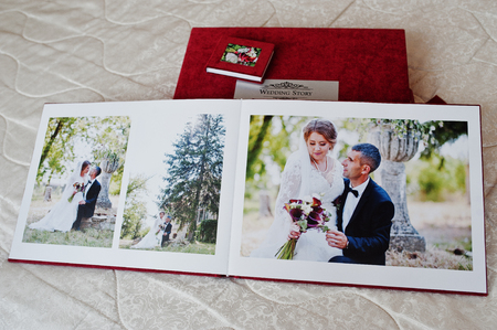 Pages of red wedding photobook or wedding album on white background.の写真素材