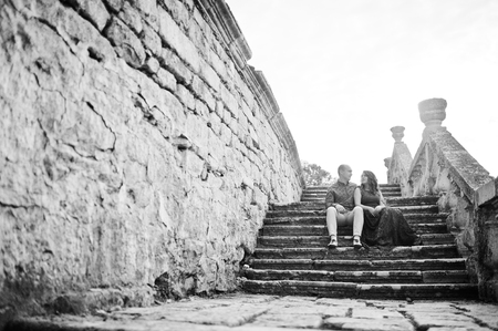 Lovely couple in love against old castle. Girl in blue dress.の写真素材
