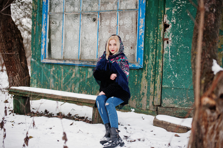 Blonde girl with hand embroidered scarf posed at winter day. Women's handkerchief.の写真素材