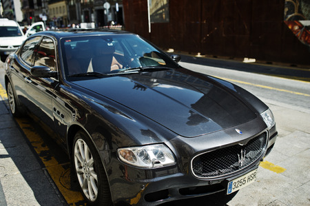 Madrid, Spain - 24 August, 2017: black Maserati Quattroporte on the street of a town.