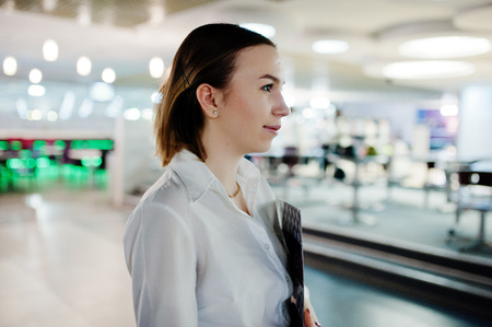 Waiter girl holding menu at cafe. People and service conceptの写真素材