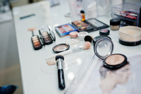 Many brushes on a table in the salon. Workplace makeup artist. Set of brushes for makeup.の写真素材