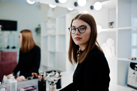 Make up artist work in her beauty visage studio salon. Woman professional make up master. Beauty club concept.の写真素材