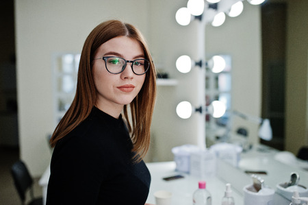 Make up artist work in her beauty visage studio salon. Woman professional make up master. Beauty club concept.の写真素材