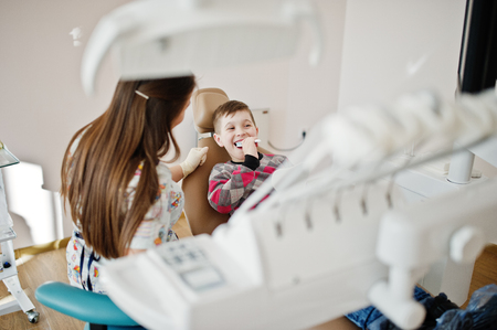 Little boy at dentist chair. Children dental.の写真素材