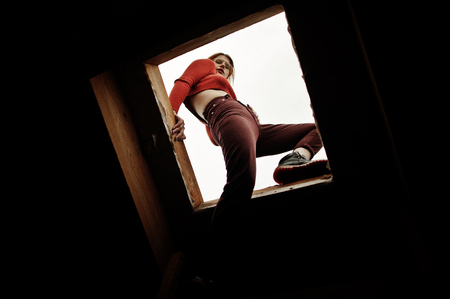 Fashion portrait of redhaired sexy girl on roof. Model attractive seduction woman.