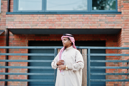 Middle Eastern arab man posed on street against modern building.の写真素材