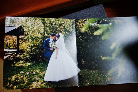 Pages of grey wedding photo book or album depicting wedding couple.の写真素材