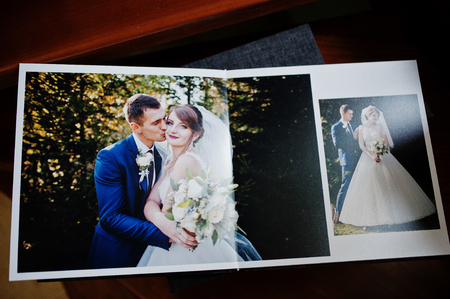 Pages of grey wedding photo book or album depicting wedding couple.の写真素材
