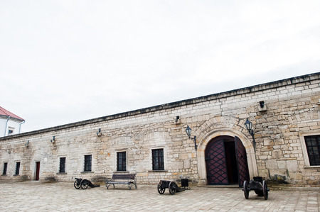 Zbarazh, Ukraine - July 24, 2018: Old castle wall with medieval cannons next to it.のeditorial素材