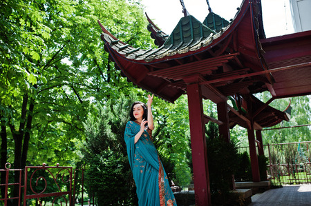Portrait of beautiful Indian brunette girl model against Japanese traditional house.の写真素材