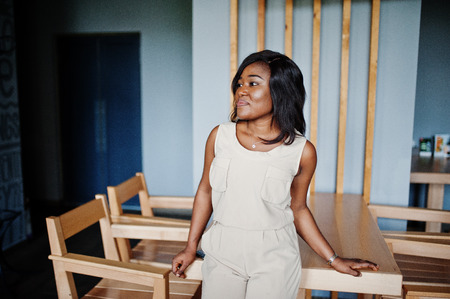 Stylish african american girl posed at modern cafe.の写真素材