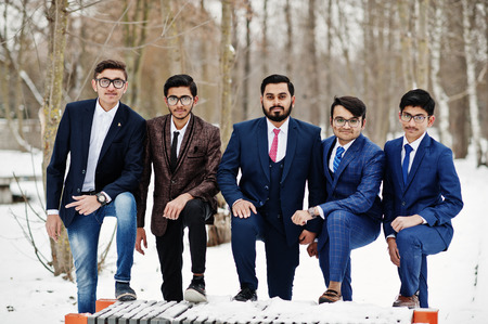 Group of five indian businessman in suits posed outdoor in winter day at Europe.の写真素材