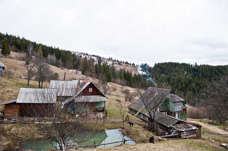 Old wooden vintage and rusty house at Carpathian mountains.の写真素材