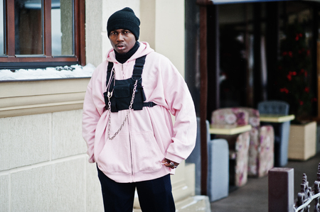 Stylish urban style african american man in pink hoodie posed.の写真素材