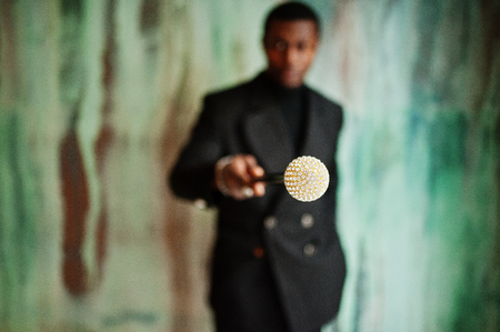 Stylish african american gentleman in elegant black jacketの写真素材