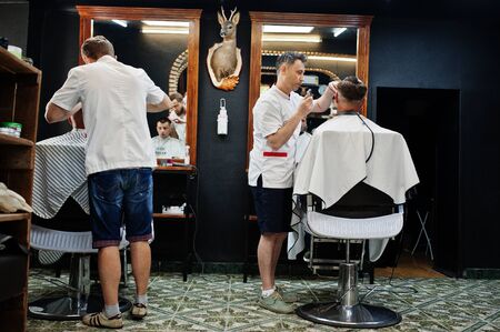 Hai, Ukraine - June 14 2019: Professional hairstylists in barbershop interior.のeditorial素材