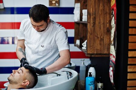Hai, Ukraine - June 14 2019: Professional hairstylists in barbershop interior.のeditorial素材