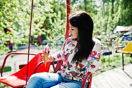 Brunette girl at amusement park.の写真素材