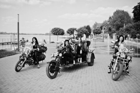 Ukraine, Tarnopol - September 8, 2018: Group of young girls at hen party on choppers and wear black...