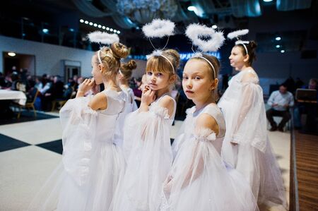 Kyiv, Ukraine - September 1, 2019: Childrens angels in white dresses at Christmas event.のeditorial素材